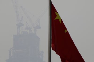 A Chinese flag is seen near a construction site in Beijing