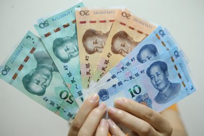 A person shows the fifth set of RMB 2019 edition in Shanghai, China, 30 August 2019 (Photo: Reuters/Imagine China).