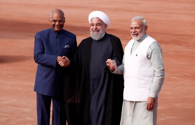 Iranian President Hassan Rouhani (C) holds hands with Indian President Ramnath Kovind (L) and Indian Prime Minister Narendra Modi at Rouhani