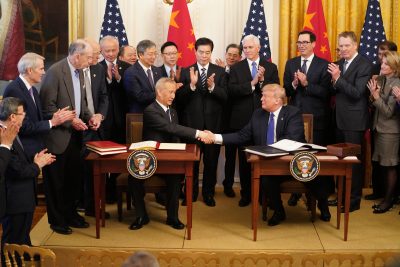 U.S. President Donald Trump (RIGHT) and Chinese Vice Premier Liu He (LEFT), who is also a member of the Political Bureau of the Communist Party of China Central Committee and chief of the Chinese side of the China-U.S. comprehensive economic dialogue, sign the China-U.S. phase-one economic and trade agreement during a ceremony at the East Room of the White House in Washington D.C., the United States, 15 January 2020 (Photo:Reuters).