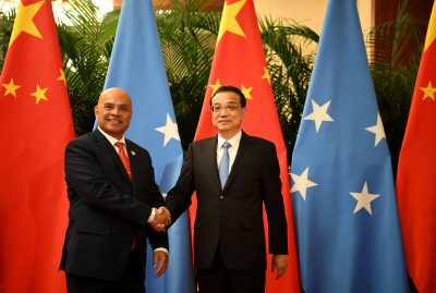 China’s Premier Li Keqiang shakes hands with Micronesia