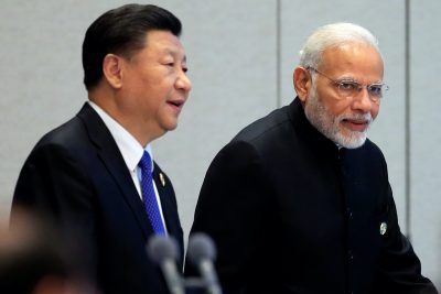 China's President Xi Jinping and India's Prime Minister Narendra Modi arrive for a signing ceremony during Shanghai Cooperation Organization (SCO) summit in Qingdao, Shandong Province, China, 10 June, 2018 (Reuters/Aly Song).