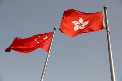 The Chinese and Hong Kong flags flutter at the office of the Government of the Hong Kong Special Administrative Region, 3 June 2020 (Photo: Reuters/Carlos Garcia Rawlins).