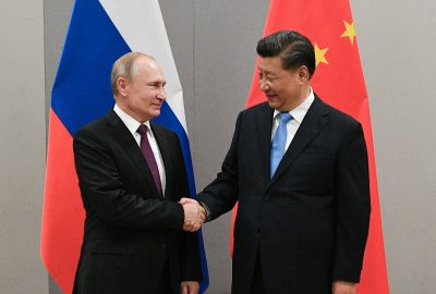 Russian President Vladimir Putin shakes hands with Chinese President Xi Jinping during their meeting on the sideline of the 11th edition of the BRICS Summit in Brasilia, Brazil, 13 November 2019 (Photo: Reuters/Sputnik/Ramil Sitdikov/Kremlin).