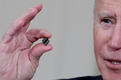 US President Joe Biden holds a semiconductor chip as he speaks prior to signing an executive order, aimed at addressing a global semiconductor chip shortage, in the State Dining Room at the White House in Washington, United States, 24 February, 2021 (Photo: REUTERS/Jonathan Ernst/File Photo).