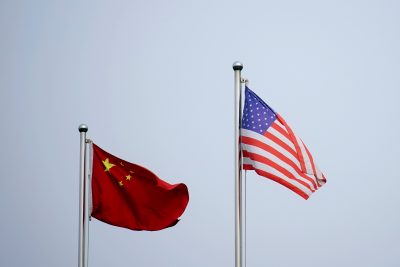 Chinese and U.S. flags flutter outside a company building in Shanghai, China 14 April 2021 (Photo: Reuters/Aly Song).