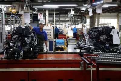 Employees work at an assembly line in the Proton manufacturing plant, Tanjung Malim, Malaysia, 16 December 2019 (Photo: Reuters/Lim Huey Teng).