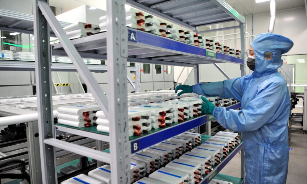 An employee works on a production line of lithium batteries at the workshop of a new energy lithium battery industrial park in Yichang, Hubei Provice, China on 28 August (Photo: Reuters/Zhang Guorong)