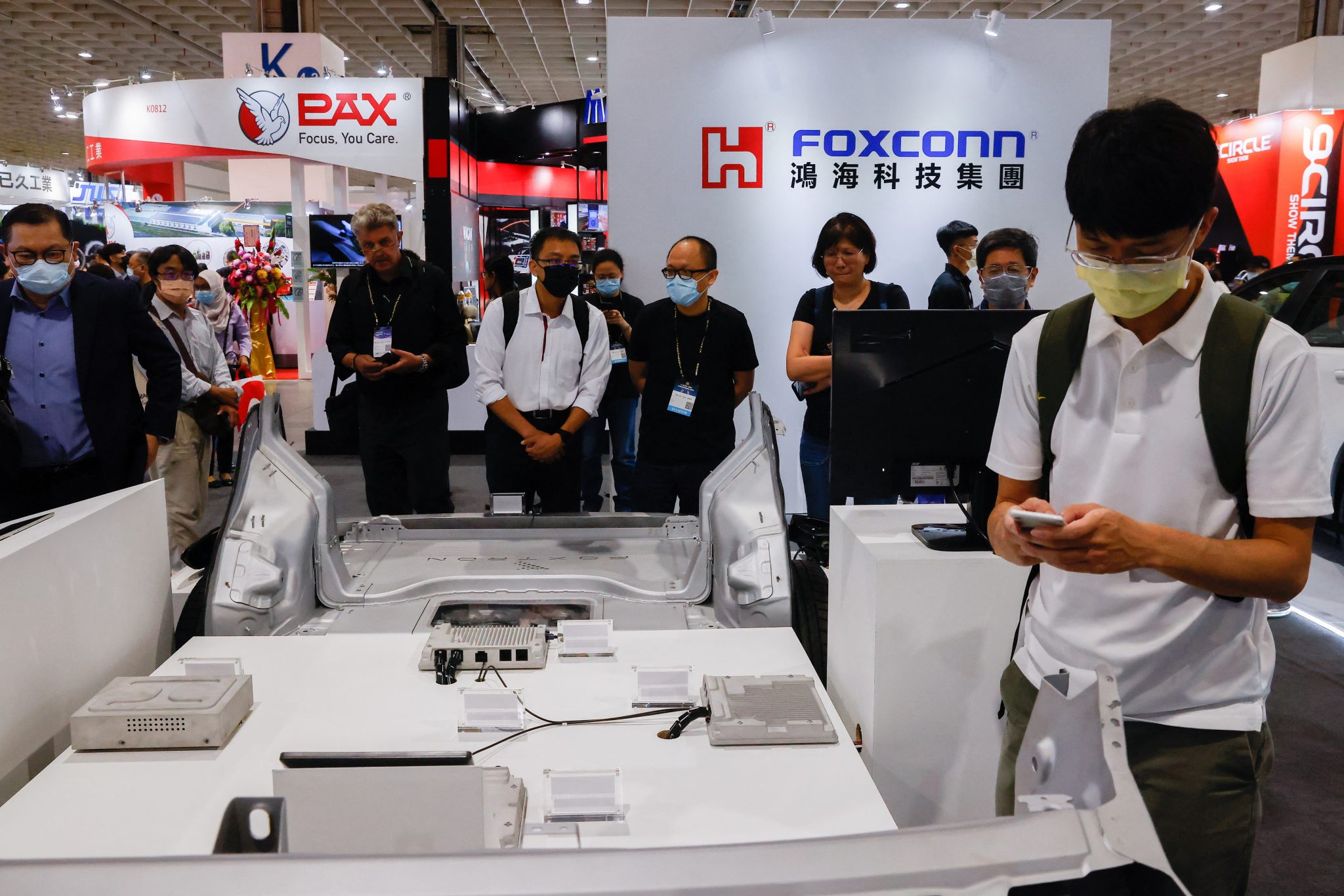 People gather at the Foxconn booth at 2035 E-Mobility Taiwan in Taipei, Taiwan, 13 April 2023 (Photo: REUTERS/Ann Wang)