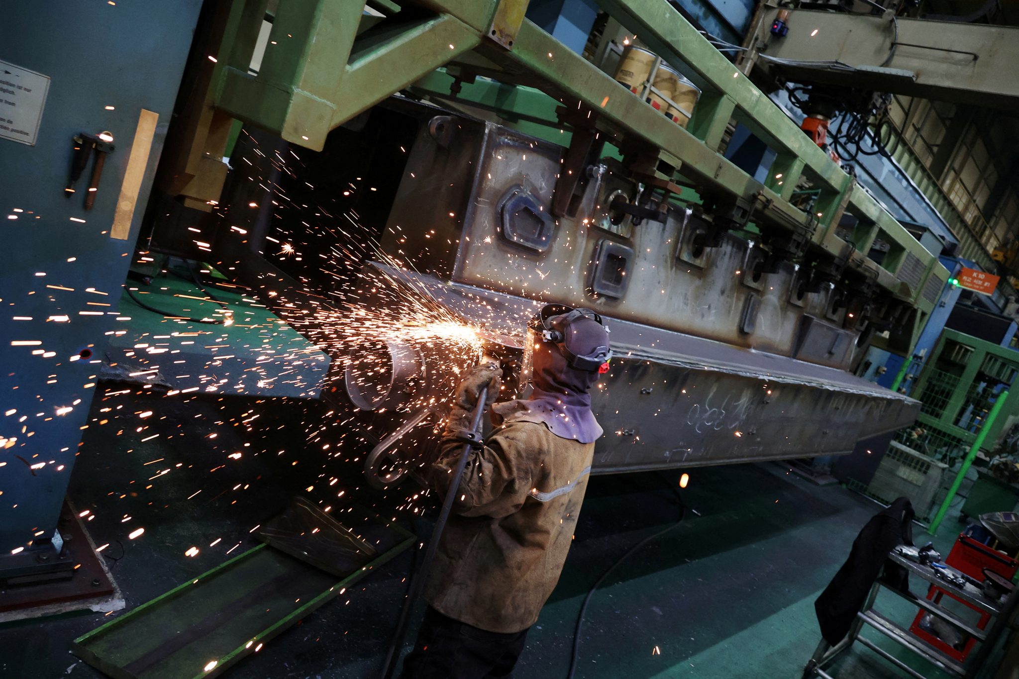 A Hanwha Aerospace engineer works on a KAAV (Korean Amphibious Assault Vehicle) at Hanwha Aerospace factory in Changwon, South Korea, 16 March 2023 (Photo: Reuters/Kim Hong-Ji).