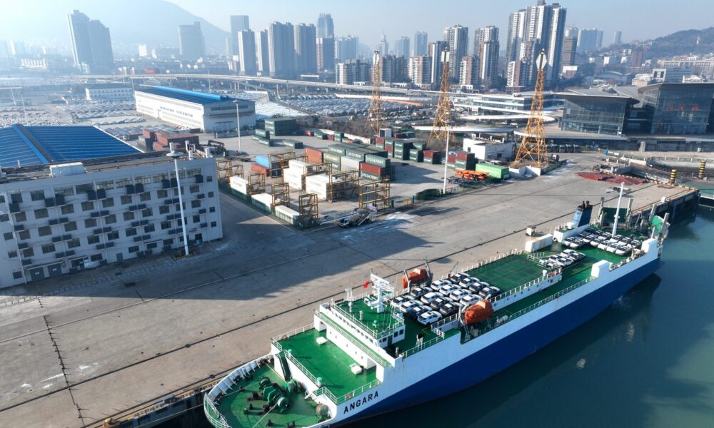 Roll-on wheels load cars for export at a dock in Lianyungang, China, 24 December 2023 (Photo: Reuters/CFOTO/Sipa USA).