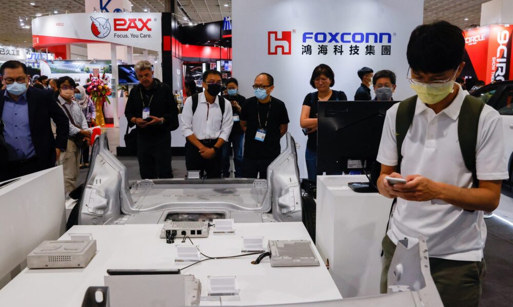 People gather at the Foxconn booth at 2035 E-Mobility Taiwan in Taipei, Taiwan, 13 April 2023 (Photo: REUTERS/Ann Wang)